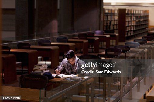 Student working in library at night Student working in library at night
