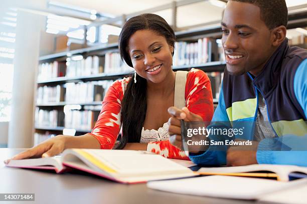 students working together in library - african ethnicity student stock pictures, royalty-free photos & images