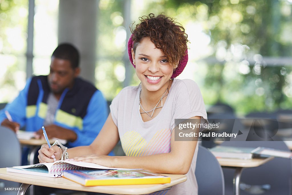Student working at desk in classroom