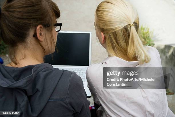 Young Woman Using Laptop Computer Rear View High-Res Stock Photo ...