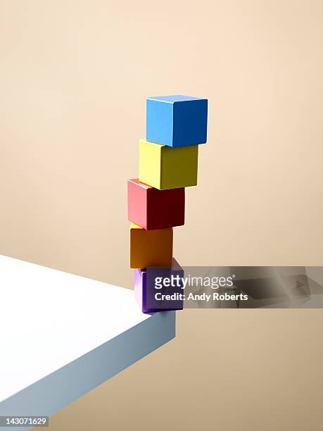 Stack of colorful cubes on table corner