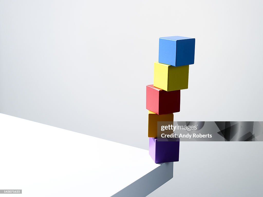 Stack of colorful cubes on table corner