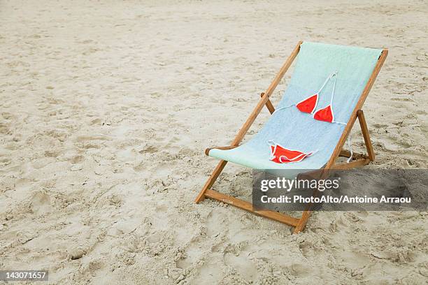 bikini left on lounge chair at the beach - bottom funny stock pictures, royalty-free photos & images