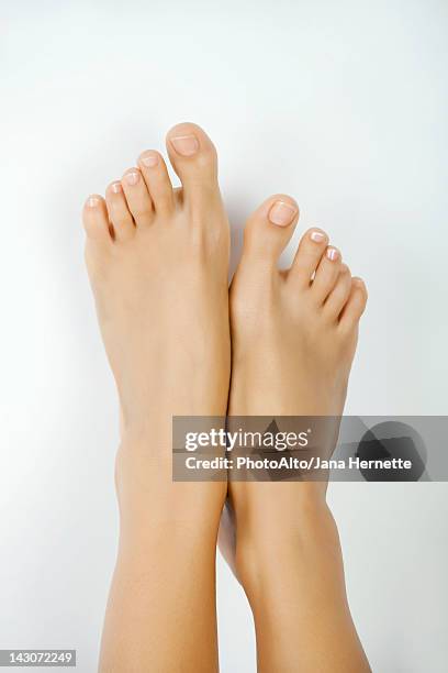 woman's bare feet - womens pretty feet stock pictures, royalty-free photos & images