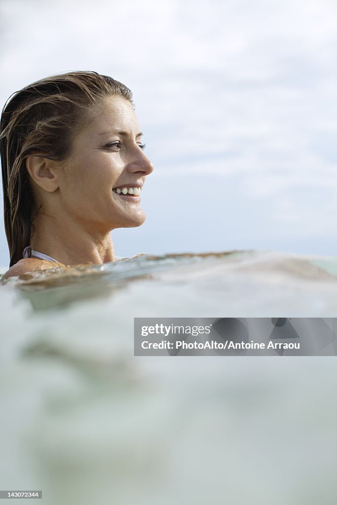 Woman swimming, profile