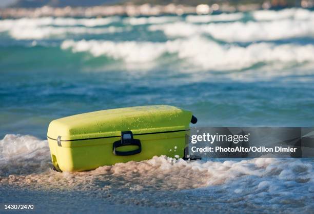 suitcase on beach - waters edge stock pictures, royalty-free photos & images