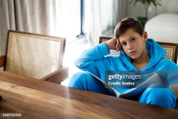 boy doing his school work or homework - dyslexia stock pictures, royalty-free photos & images
