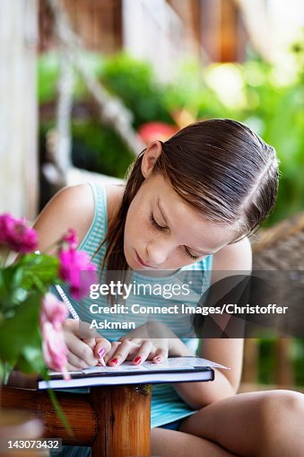 Writing Notebook Outside Girl Writing On Notebook Outdoors High-Res Stock Photo - Getty Images