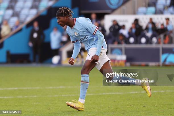 Joel Ndala of Manchester City celebrates after scoring their sides first goal during the UEFA Youth League match between Manchester City and FC...