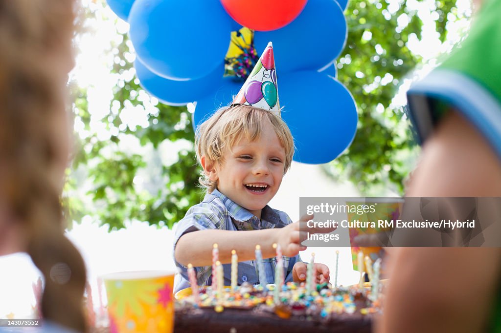 Boy having drink at birthday party