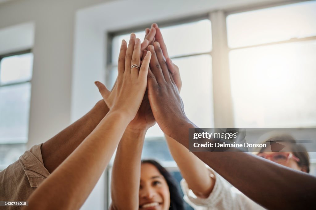 Teamwork, motivation and business people high five collaboration in support of global mission success in office. Goal, vision and team building by fun colleagues hands connected in planning strategy
