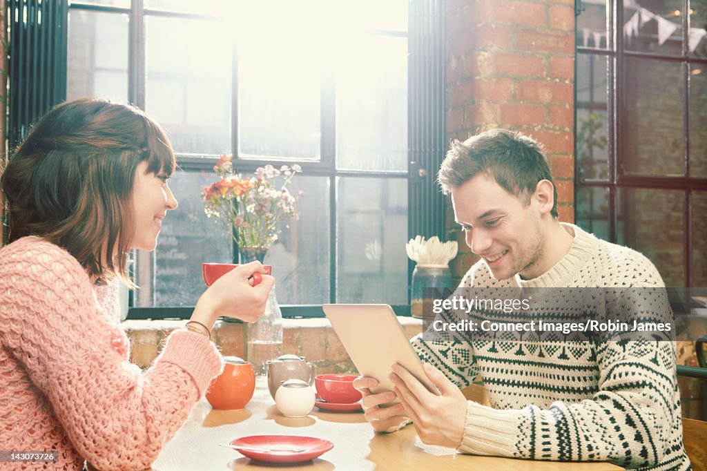 Couple having coffee in cafe