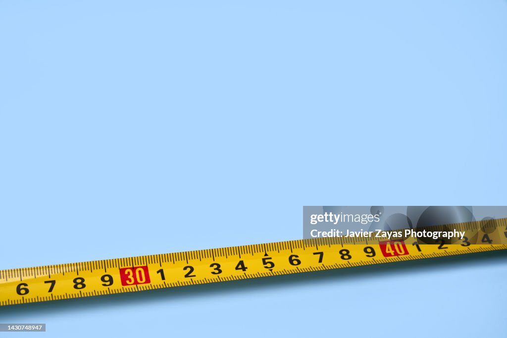 Yellow Ruler On Blue Background