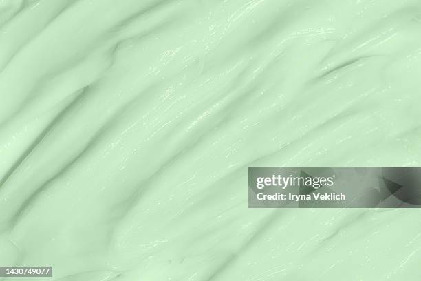 beauty cosmetic product texture of delicate green smears  - green turquoise color hair mask or facial cream,  hand cream, face mask. - ミントグリーン ストックフォトと画像