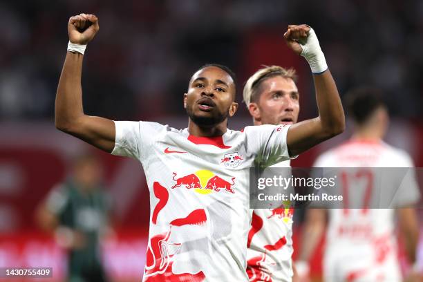 Christopher Nkunku of RB Leipzig celebrates after scoring their team's first goal during the UEFA Champions League group F match between RB Leipzig...