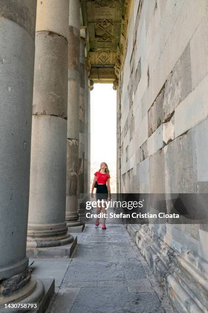 girl exploring the ancient garni pagan temple in armenia - armenian church stock pictures, royalty-free photos & images