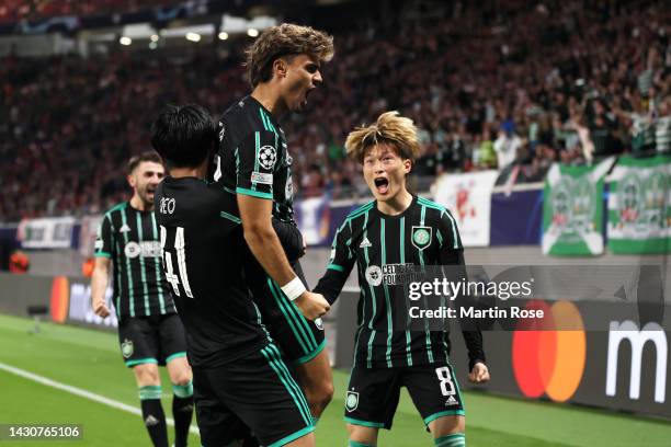 Jota of Celtic celebrates with teammates after scoring their team's first goal during the UEFA Champions League group F match between RB Leipzig and...