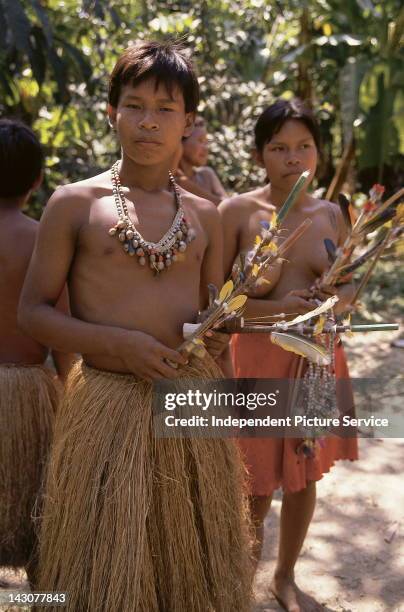 Peruvians wearing traditional dress. Peru, Amazon Region.