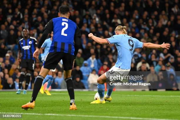 Erling Haaland of Manchester City scores their team's first goal during the UEFA Champions League group G match between Manchester City and FC...