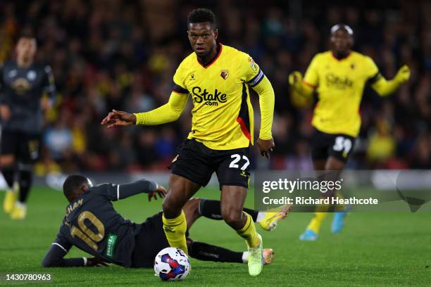 Christian Kabasele of Watford battles for the ball with Olivier Ntcham of Swansea City during the Sky Bet Championship match between Watford and...