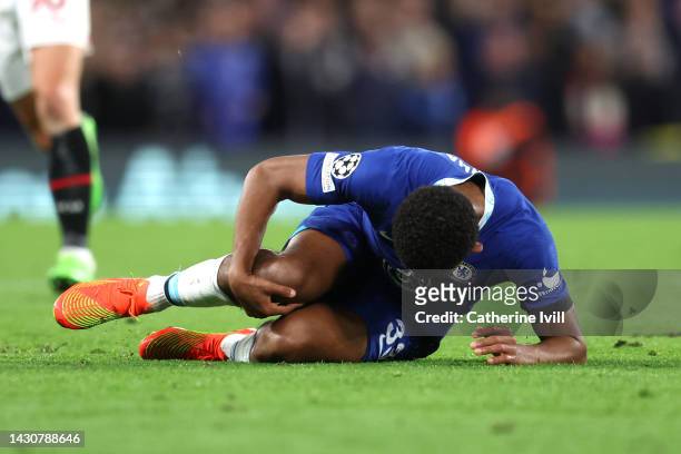 Wesley Fofana of Chelsea is seen injured during the UEFA Champions League group E match between Chelsea FC and AC Milan at Stamford Bridge on October...