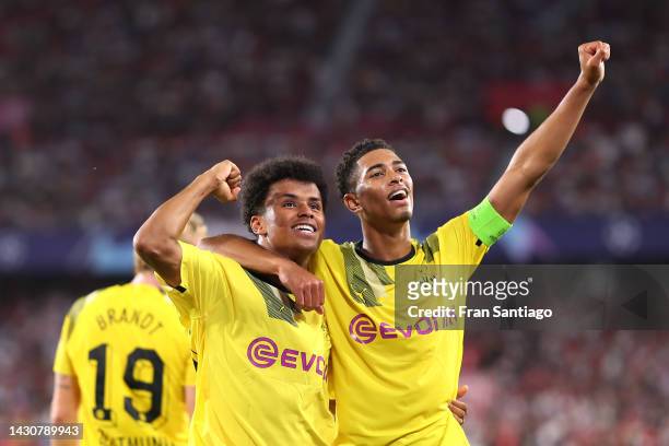 Karim Adeyemi of Borussia Dortmund celebrates with teammate Jude Bellingham after scoring their team's third goal during the UEFA Champions League...