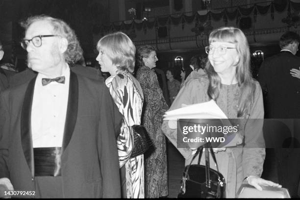 Isaac Asimov, Shirley MacLaine, guest, and Janet Asimov attend an event at the Waldorf Astoria Hotel in New York City on October 26, 1977.