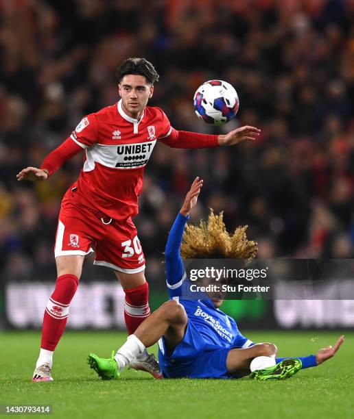 Birmingham player Hannibal Mejbri is challenged by Middlesbrough player Hayden Hackney during the Sky Bet Championship between Middlesbrough and...