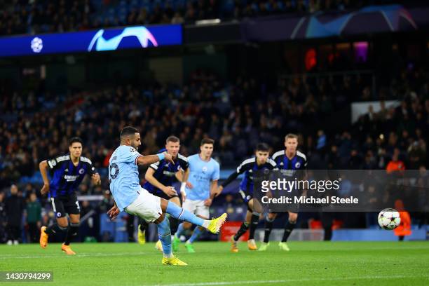 Riyad Mahrez of Manchester City scores their team's fourth goal from the penalty spot during the UEFA Champions League group G match between...