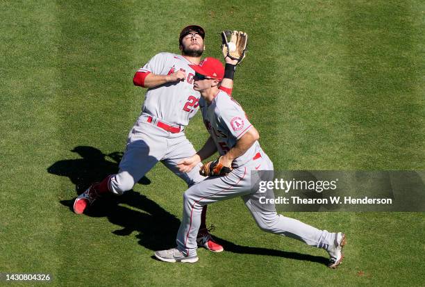 David Fletcher of the Los Angeles Angels avoids colliding with Matt Duffy while catching a pop-up on the infield off the bat of Nick Allen of the...