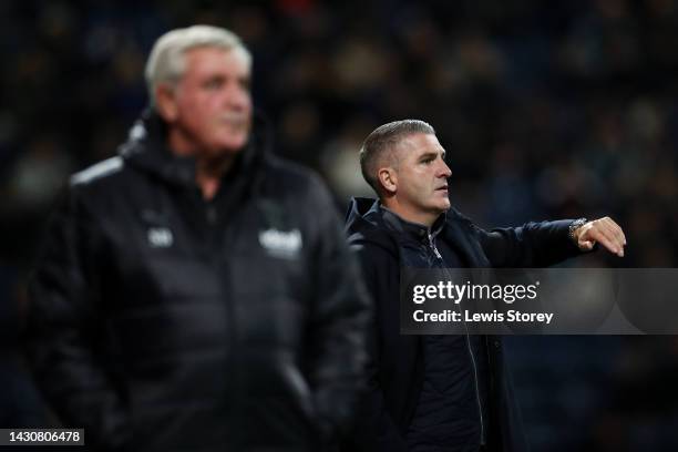 Ryan Lowe, Manager of Preston North End reacts alongside Steve Bruce, Manager of West Bromwich Albion during the Sky Bet Championship between Preston...