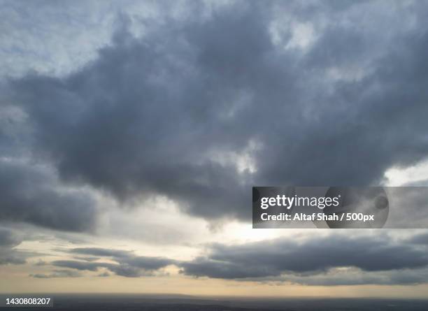 scenic view of sea against dramatic sky,united kingdom,uk - くもり ストックフォトと画像