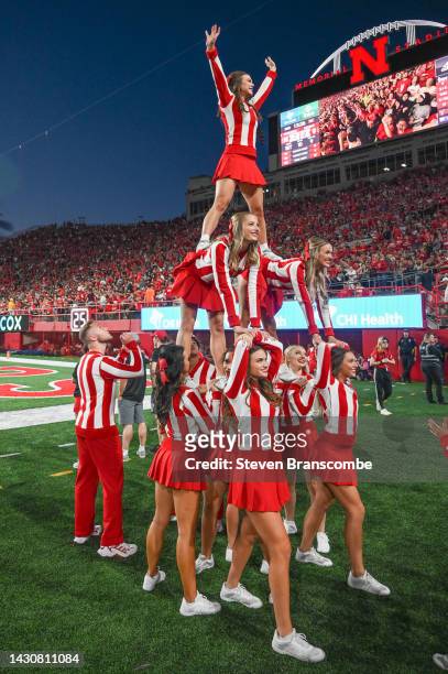 The cheerleaders for the Nebraska Cornhuskers perform during a break in the game against the Indiana Hoosiers at Memorial Stadium on October 1, 2022...