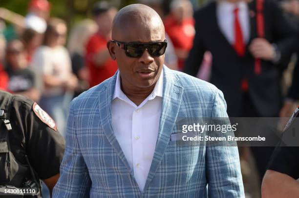 Interim head coach Mickey Joseph of the Nebraska Cornhuskers walks to the stadium with the team before the game against the Indiana Hoosiers at...