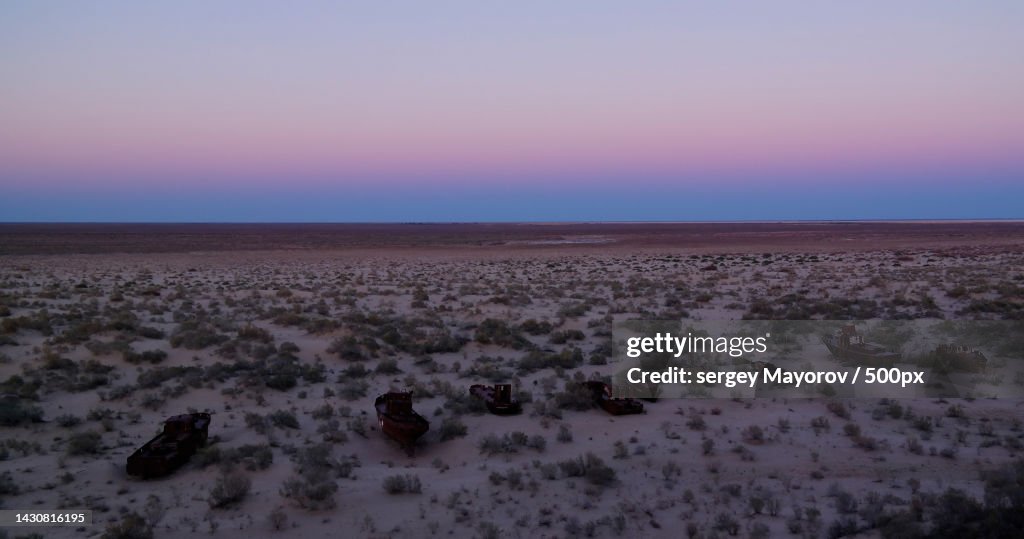 Panorama of ship cemetery at sunset near Moynaq,Karakalpakstan,Uzbekistan