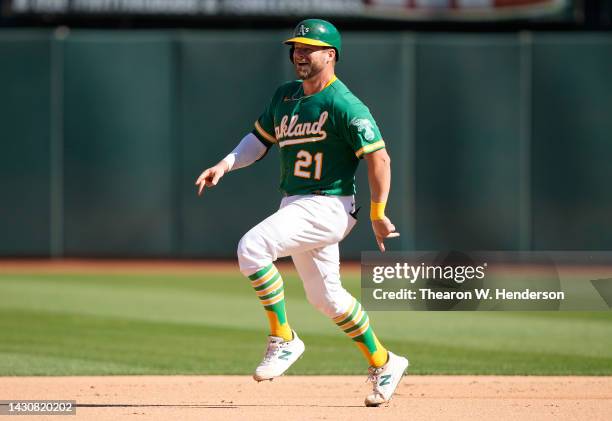 Stephen Vogt of the Oakland Athletics celebrates while trotting around the bases after hitting a solo home run against the Los Angeles Angels in the...
