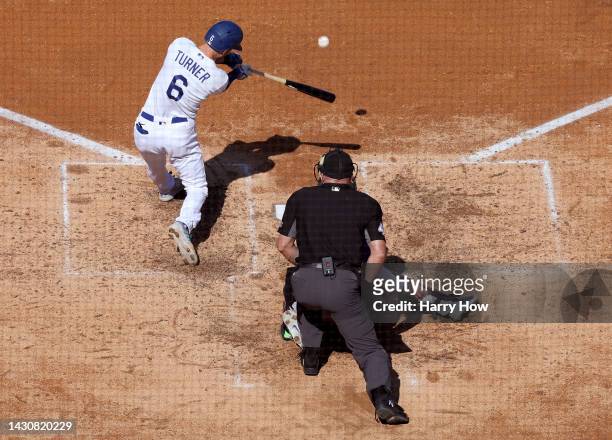 Trea Turner of the Los Angeles Dodgers hits a three run homerun, to take a 4-1 lead over the Colorado Rockies, during the fifth inning at Dodger...