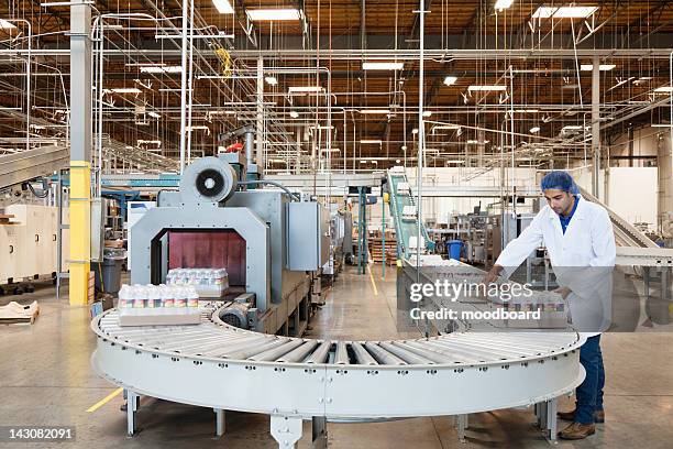 man working in bottling factory - bottling plant stock pictures, royalty-free photos & images