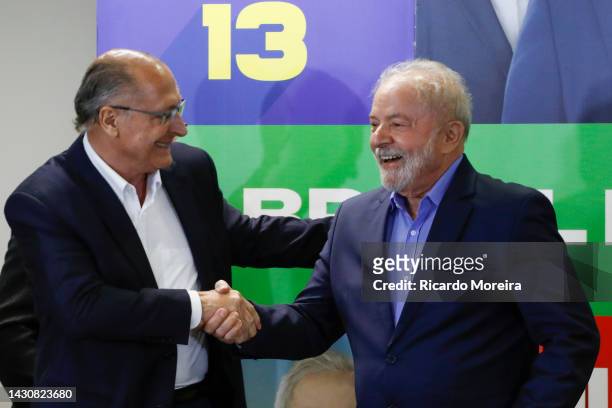 Vice presidential candidate Geraldo Alckmin shakes hands with running mate Luiz Inacio Lula da Silva of Workers' Party during a meeting with leaders...