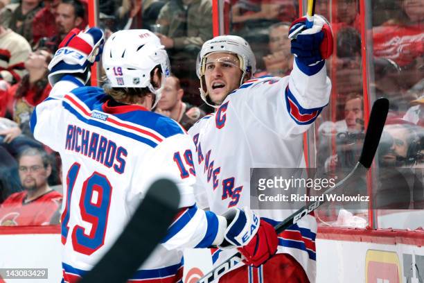Ryan Callahan of the New York Rangers celebrates his first period goal with teammate Brad Richards in Game Four of the Eastern Conference...