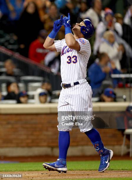 James McCann of the New York Mets celebrates his three run home run in the third inning against the Washington Nationals at Citi Field on October 05,...