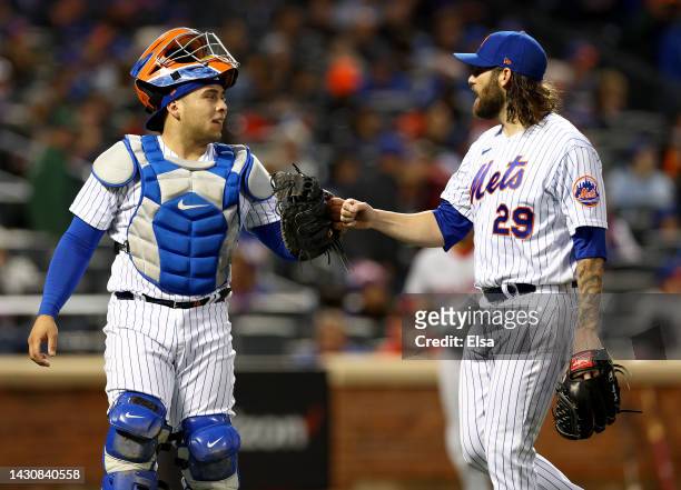 Francisco Alvarez and Trevor Williams of the New York Mets celebrate as they walk off the field in the second inning against the Washington Nationals...