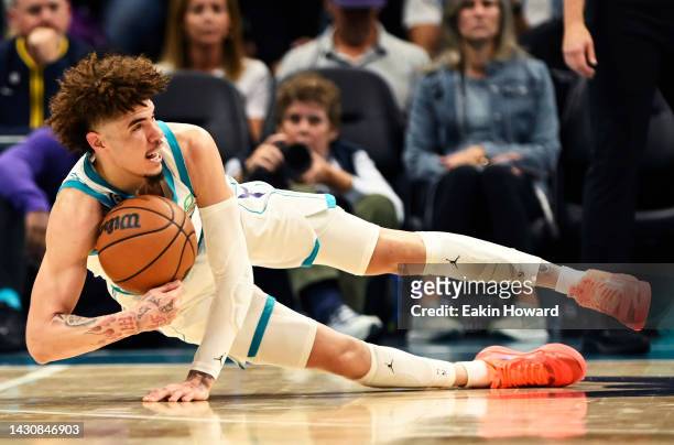LaMelo Ball of the Charlotte Hornets recovers a loose ball against the Indiana Pacers in the second quarter during a preseason game at Spectrum...