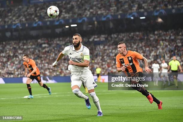 Karim Benzema of Real Madrid battles for possession against Oleksandr Zubkov of Shakhtar Donetsk during the UEFA Champions League group F match...