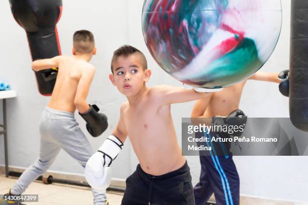 children training boxing in the garage - boxing ring stock pictures, royalty-free photos & images