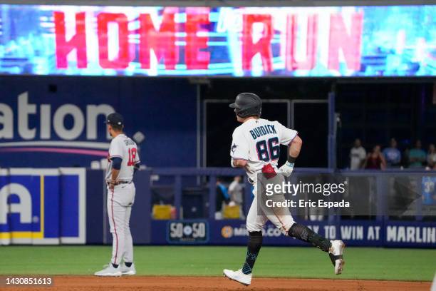 Peyton Burdick of the Miami Marlins rounds second base after hitting a home run in the seventh inning of the game against the Atlanta Braves at...