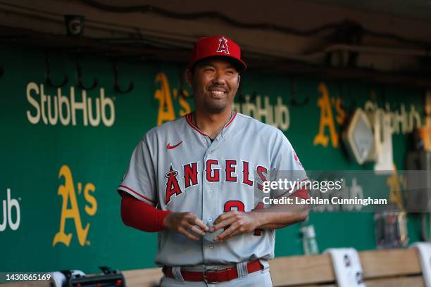 Kurt Suzuki of the Los Angeles Angels looks on from the dugout before the game against the Oakland Athletics at RingCentral Coliseum on October 04,...