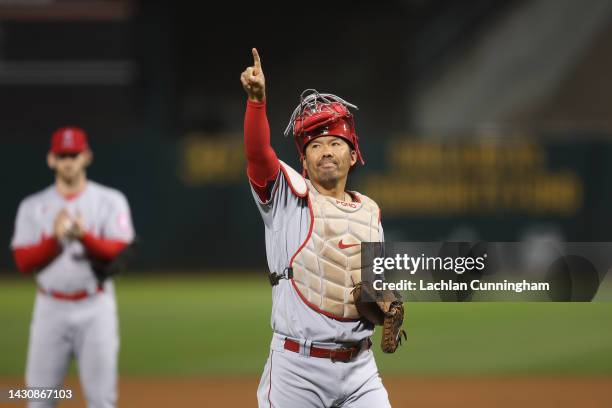 Catcher Kurt Suzuki of the Los Angeles Angels acknowledges the fans as he exits the game after the first pitch in the bottom of the first inning...