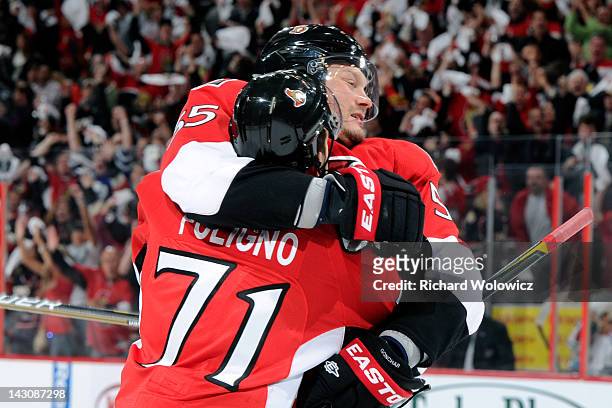 Sergei Gonchar of the Ottawa Senators celebrates his second period goal with teammate Nick Foligno in Game Four of the Eastern Conference...
