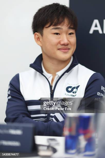 Yuki Tsunoda of Japan and Scuderia AlphaTauri talks to the media in the Paddock during previews ahead of the F1 Grand Prix of Japan at Suzuka...